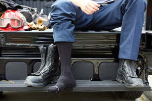 Fireman wearing wearing OPR Sock in tall boots.